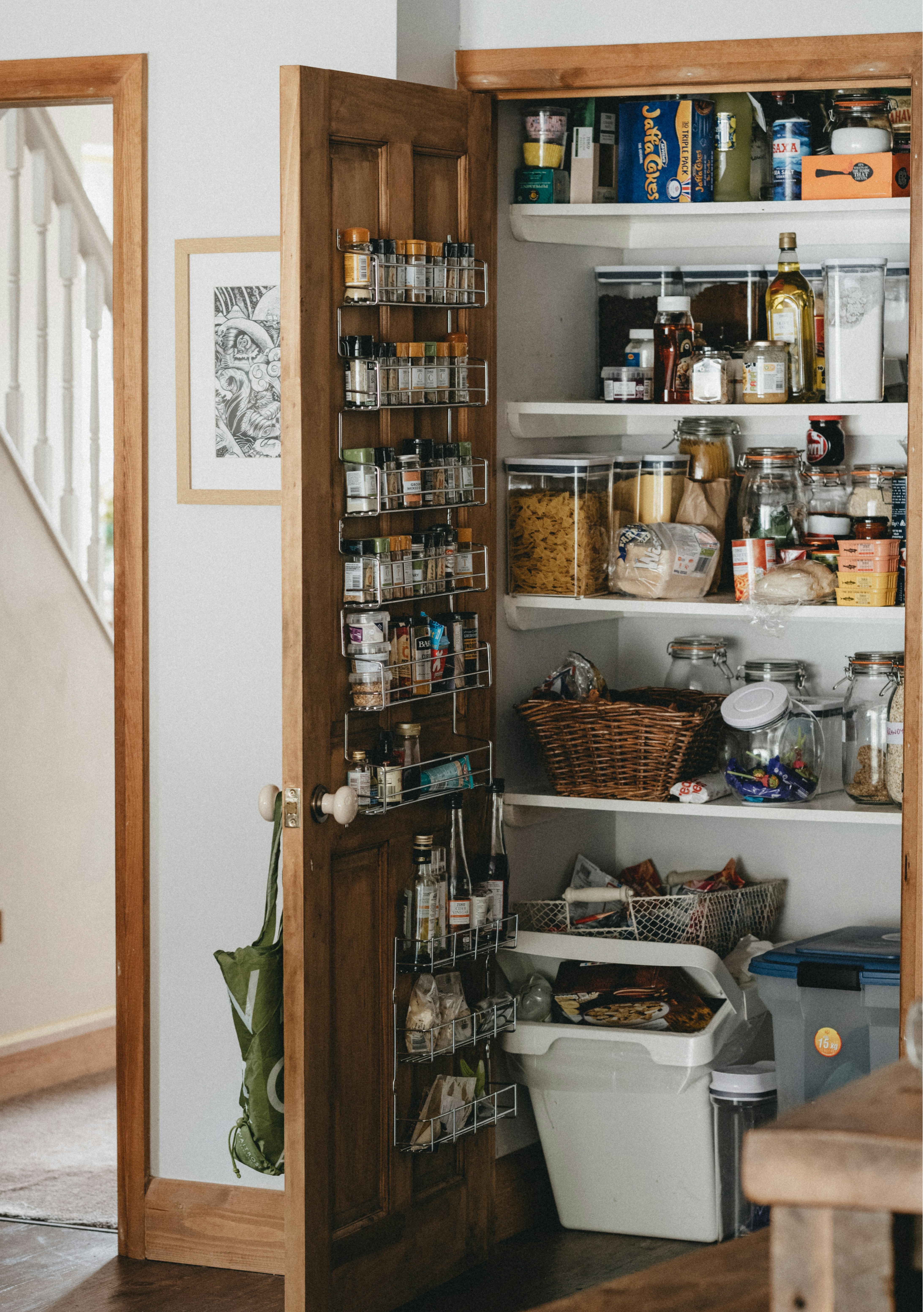 Overhead view of a well-stocked everyday kitchen counter, neutral and domestic, natural light