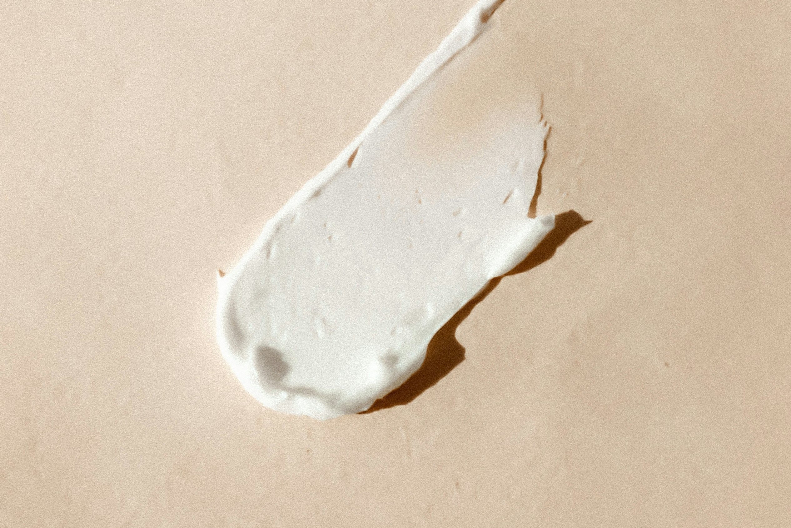 Close-up of mildly irritated or reactive skin on a forearm, neutral and clinical, soft natural light