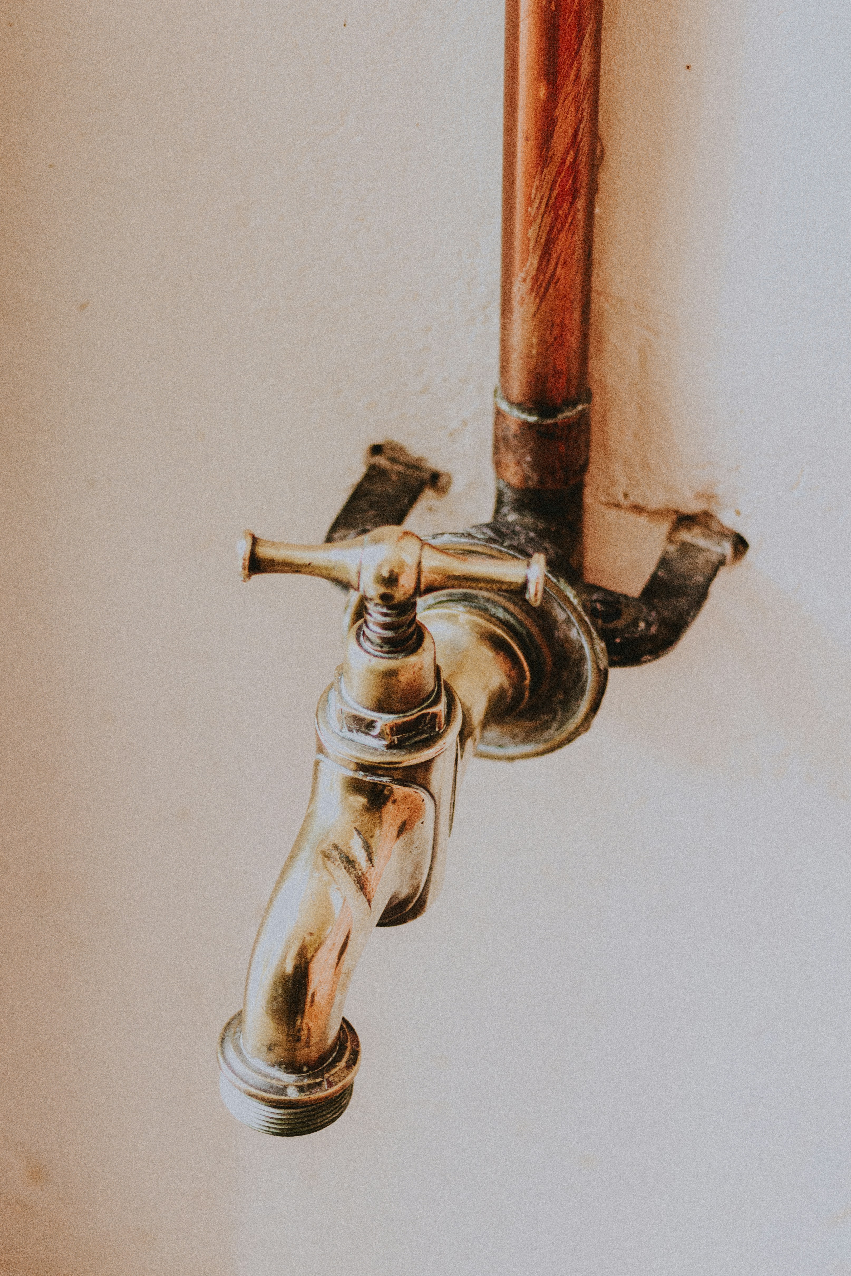 Old copper pipe exterior showing corrosion and oxidation, close-up detail