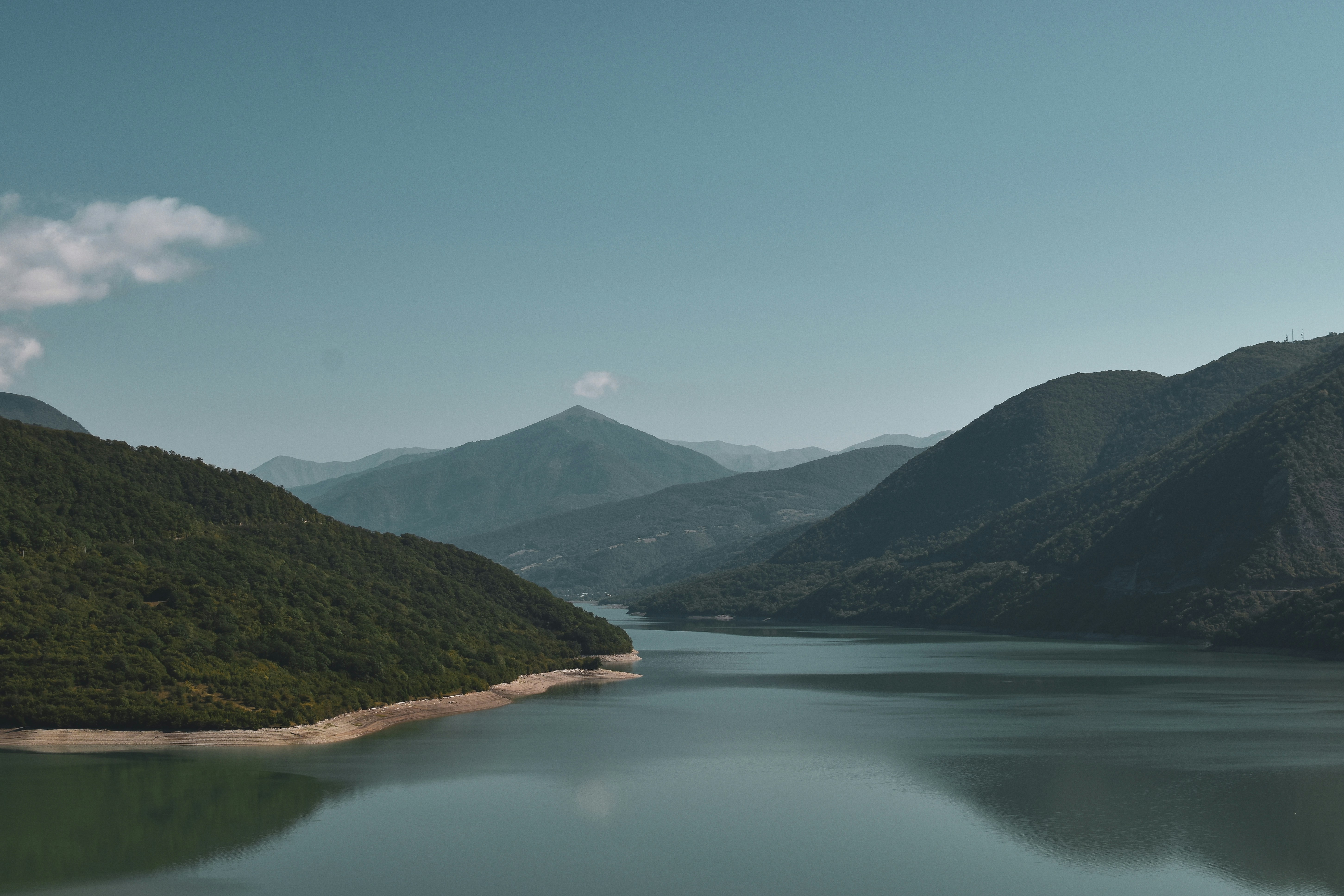 A wide calm reservoir or natural water body, open sky above, natural light